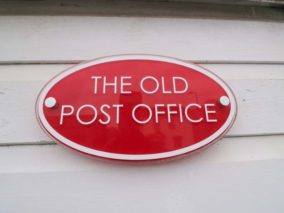 A sign that reads The Old Post Office