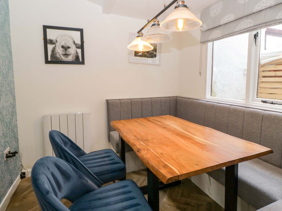 A dining room with a table and chairs at The Old Post Office in Whitehaven