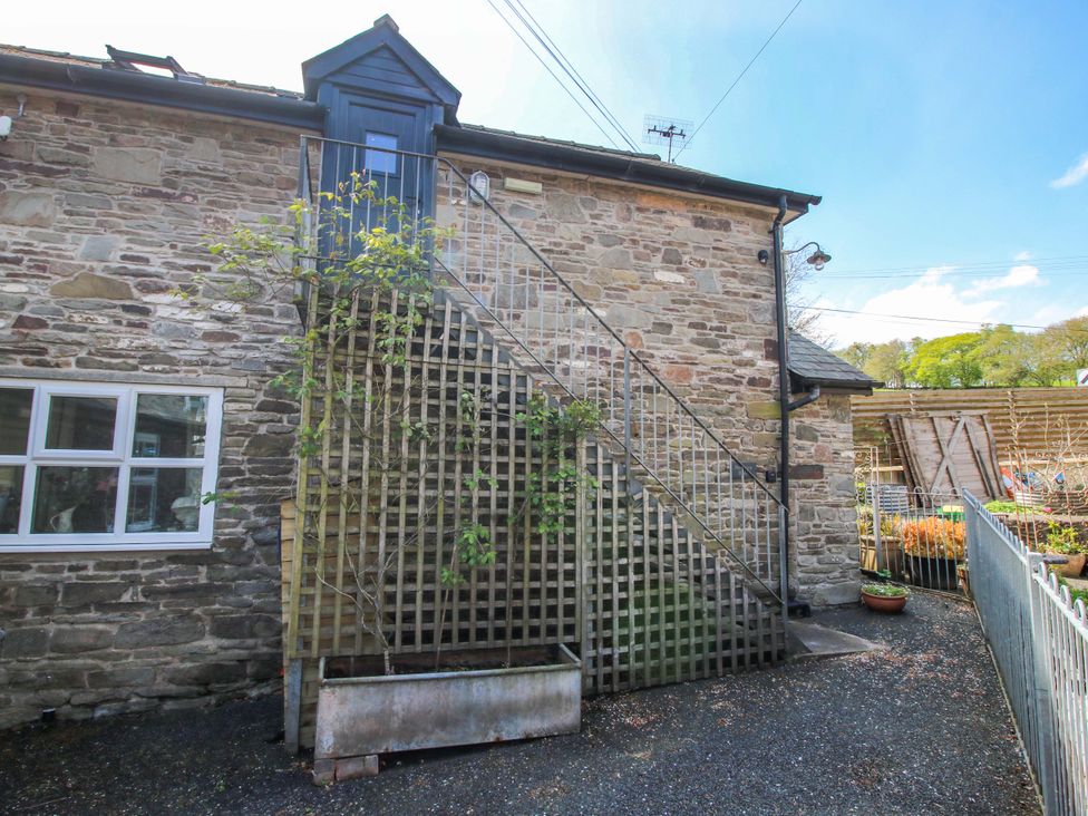 An exterior view of stone stairs and wall at Pentwyn Barn in Clyro
