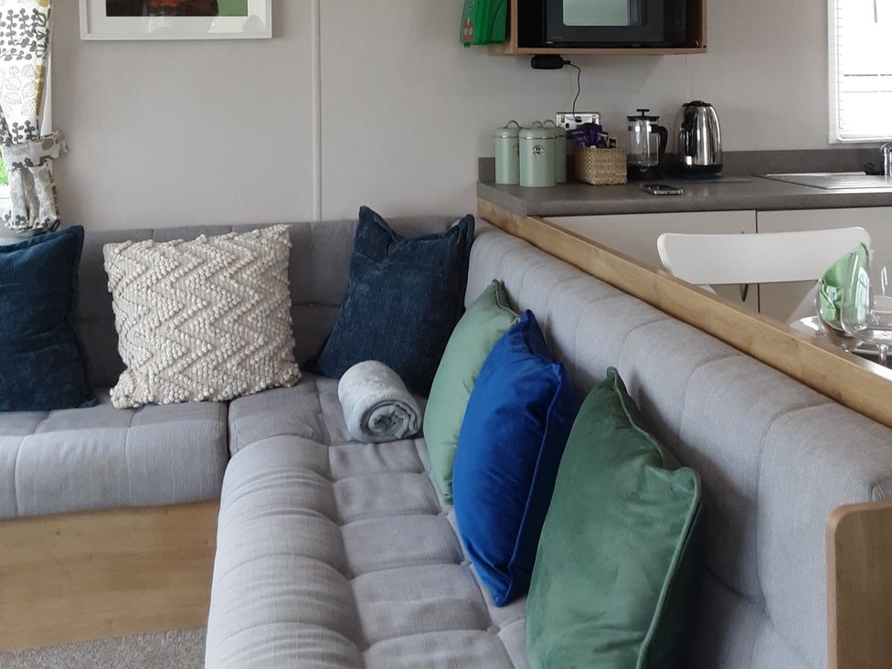 A living room with a sofa and coffee table at Josephine MB37 in Newquay