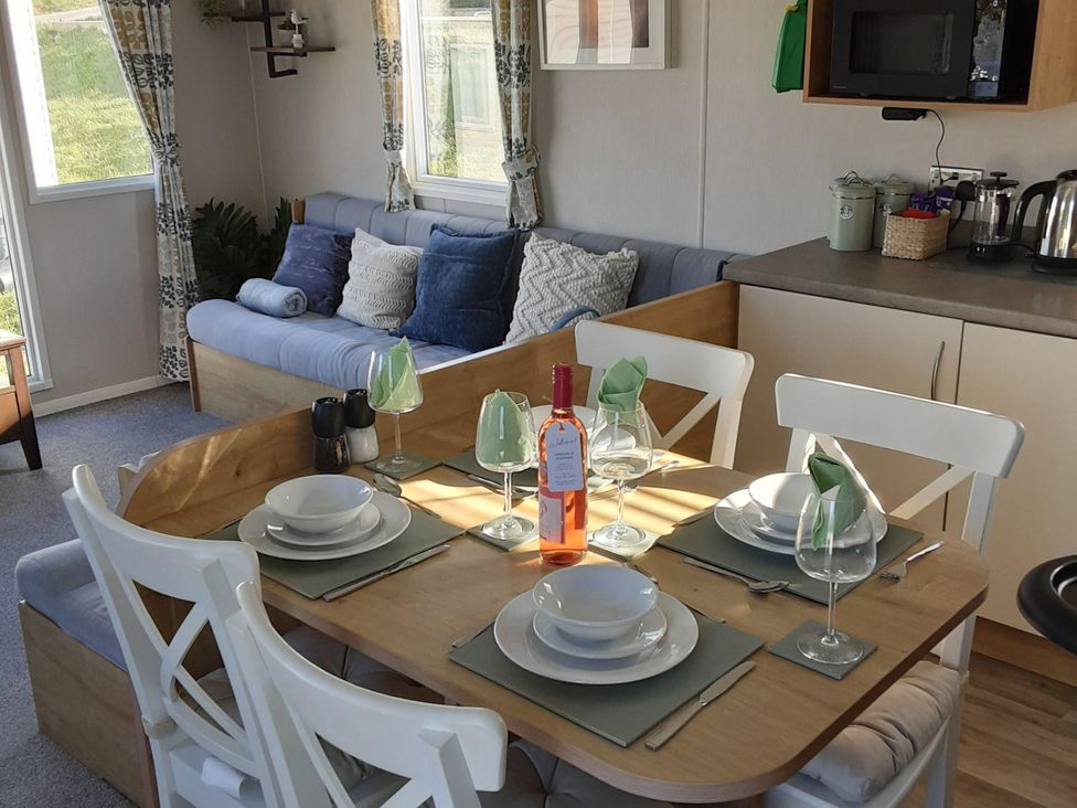 A dining room with a table set for a meal at Josephine MB37 in Newquay