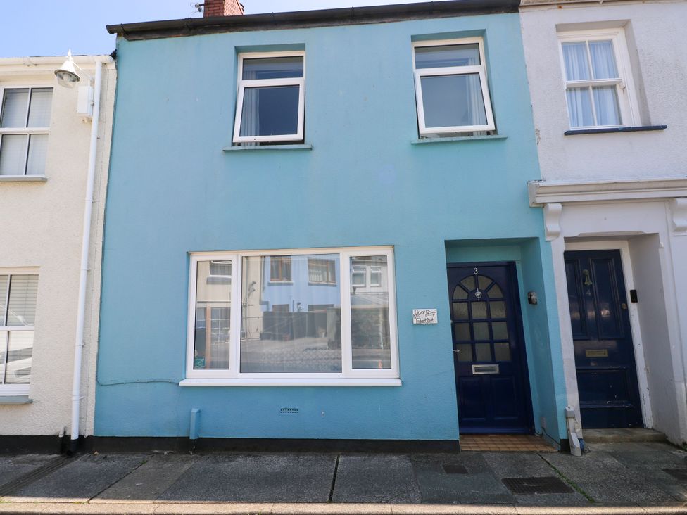 A building exterior with a blue wall and front door at 3 Edward Street Tenby