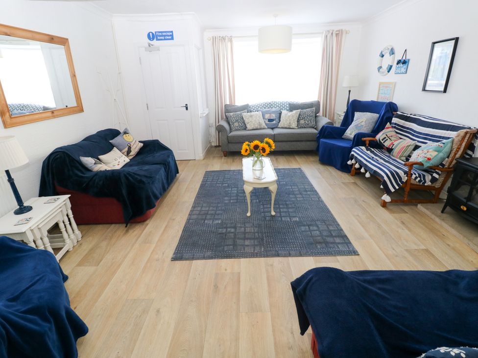 A living room with sofas and a coffee table at 3 Edward Street in Tenby