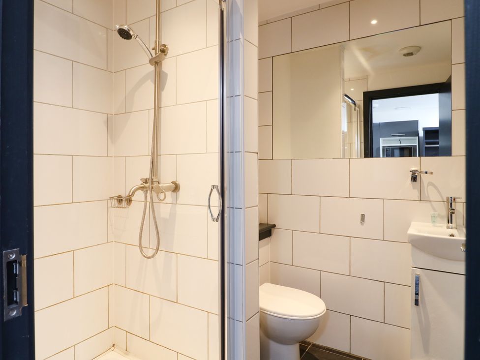A bathroom with a shower and toilet at Apartment 304 in Nottingham