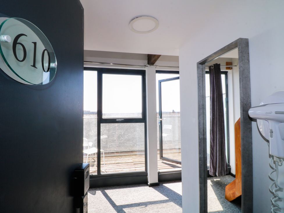 A room with an open door and windows at Apartment 610 in Nottingham