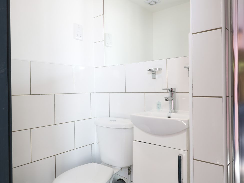 A bathroom with a toilet and sink at Apartment 610 in Nottingham