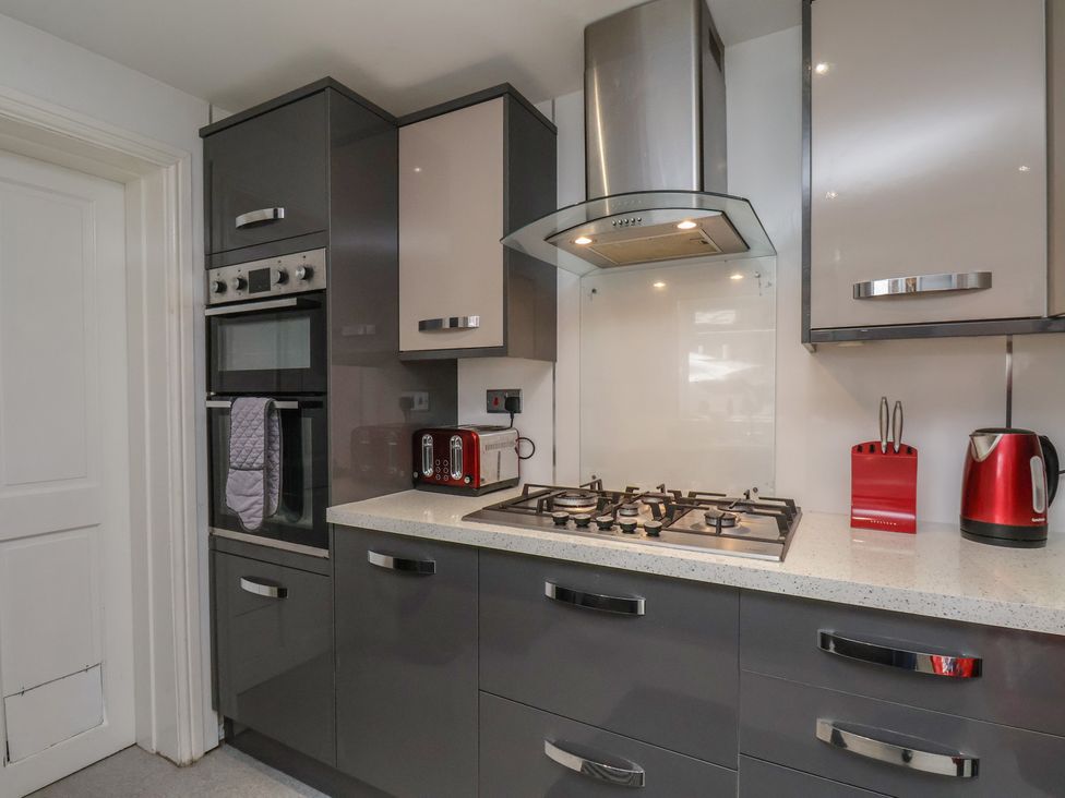 A kitchen with a gas stove and appliances at 30 Prospect Hill, Whitby