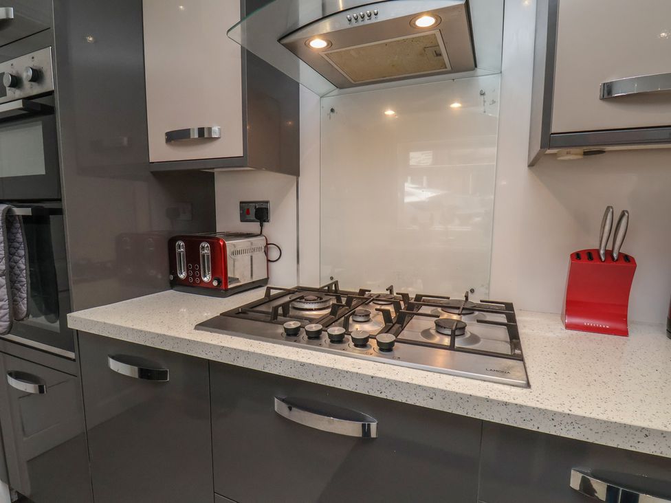 A kitchen with a gas hob and a toaster at 30 Prospect Hill in Whitby