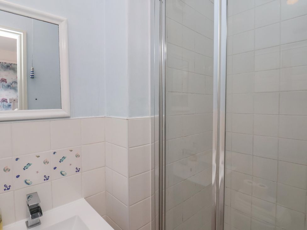 A bathroom with a sink and shower at 30 Prospect Hill in Whitby
