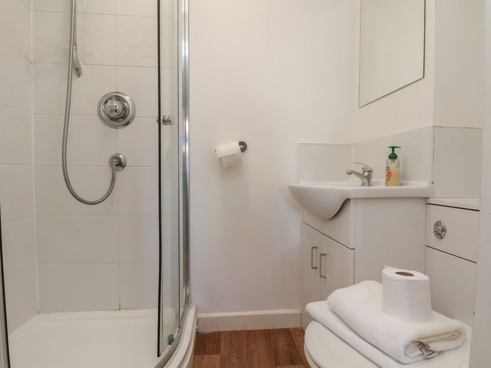A bathroom with a shower and sink at 30 Prospect Hill, Whitby