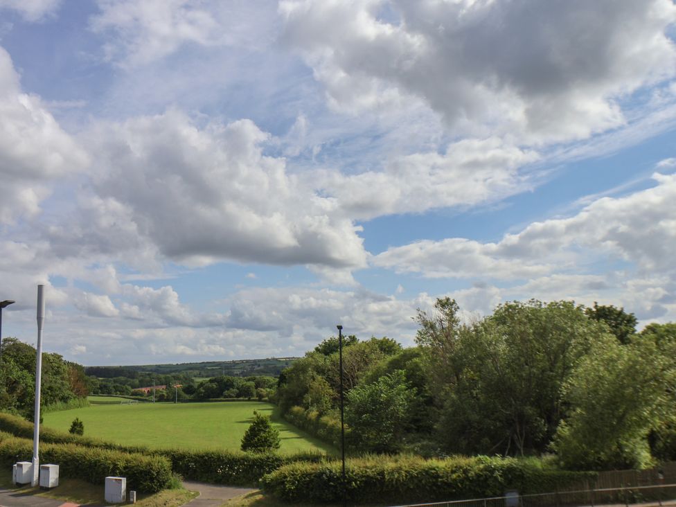 An open field with trees and clouds at 30 Prospect Hill in Whitby