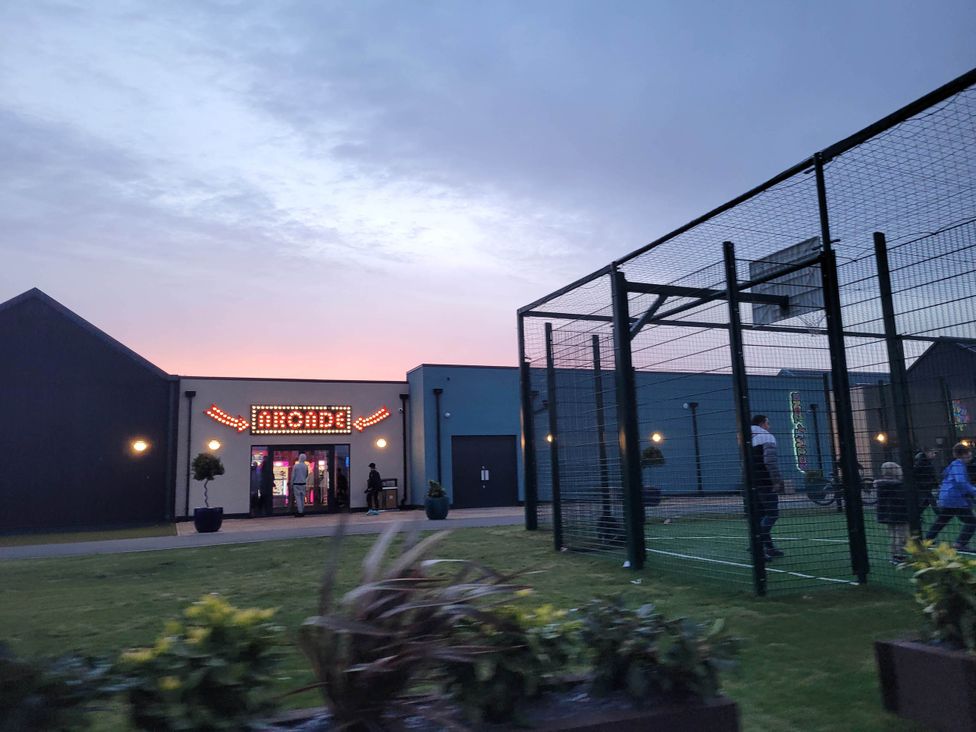 A building with an entrance and people near it at St Osyth- Sleeps8-freeparking-wifi-holidaypark Clacton-On-Sea