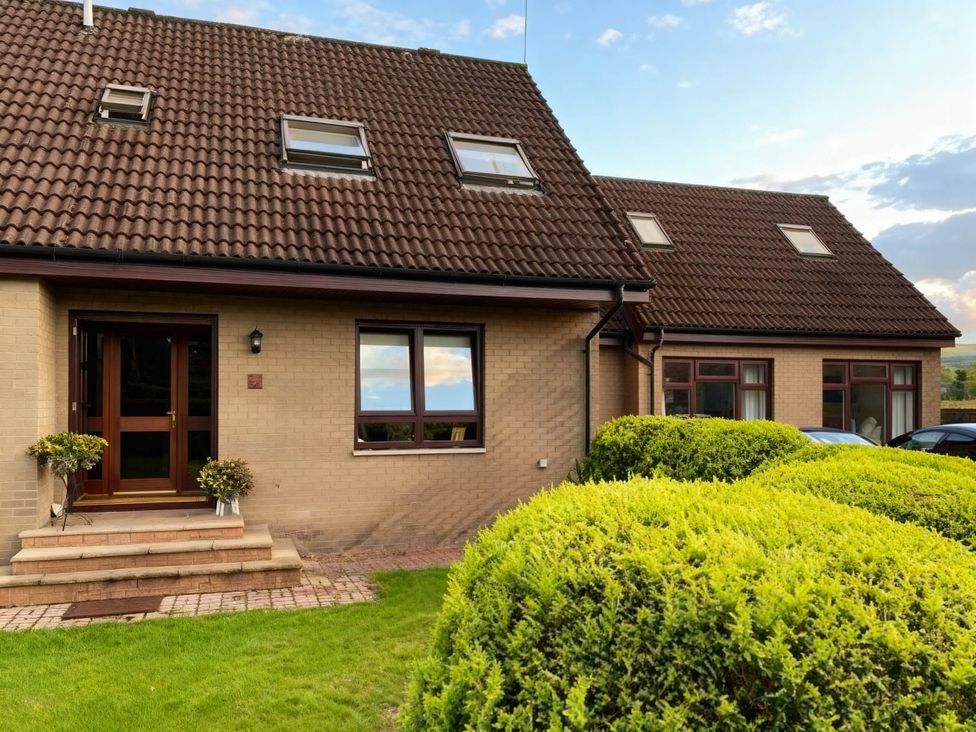 A house with a front door and garden at 1 Bed House - Central, Free Parking, Wifi, Stirling