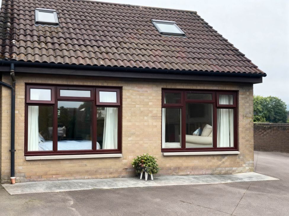 A house exterior with windows and a roof at 1 Bed House - Central, Free Parking, Wifi, Stirling
