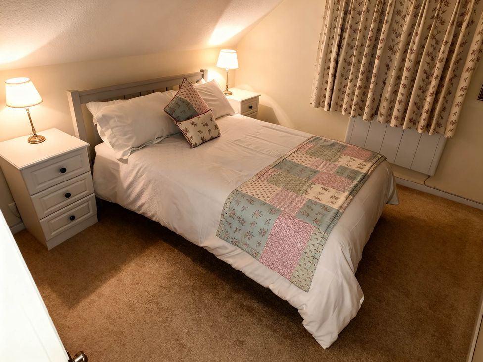 A bedroom with a double bed and bedside tables at 1 Bed House - Central, Free Parking, Wifi in Stirling