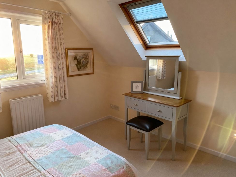 A bedroom with a bed and a vanity table at 1 Bed House - Central, Free Parking, Wifi in Stirling