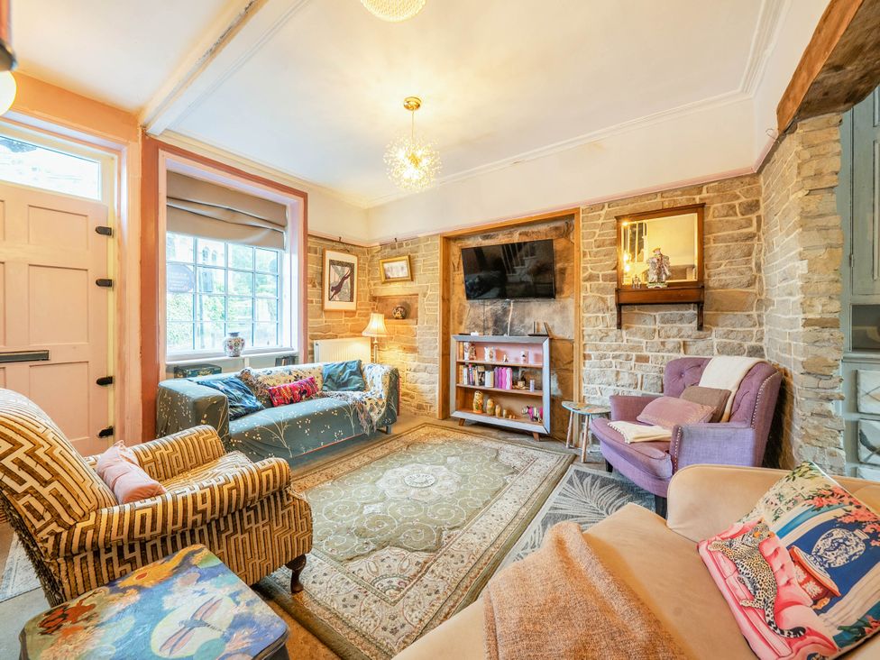 A living room with a sofa and armchair at Hebden Bridge - House - Sleeps 8 - Pet Friendly, Hebden Bridge