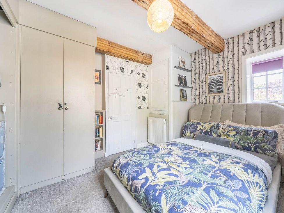A bedroom with a bed and wardrobe at Hebden Bridge - House - Sleeps 8 - Pet Friendly in Hebden Bridge