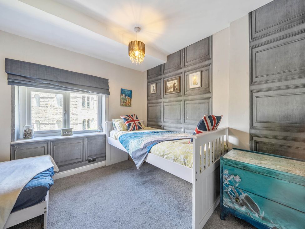 A bedroom with a bed and window at Hebden Bridge - House - Sleeps 8 - Pet Friendly, Hebden Bridge