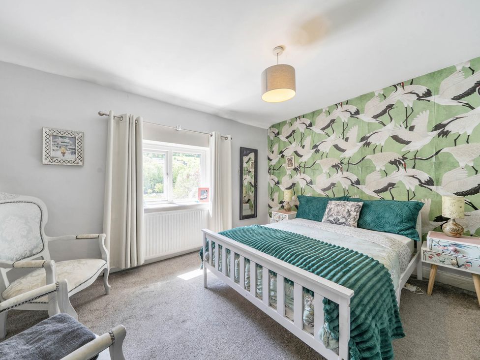 A bedroom with a bed and a window at Hebden Bridge - House - Sleeps 8 - Pet Friendly, Hebden Bridge