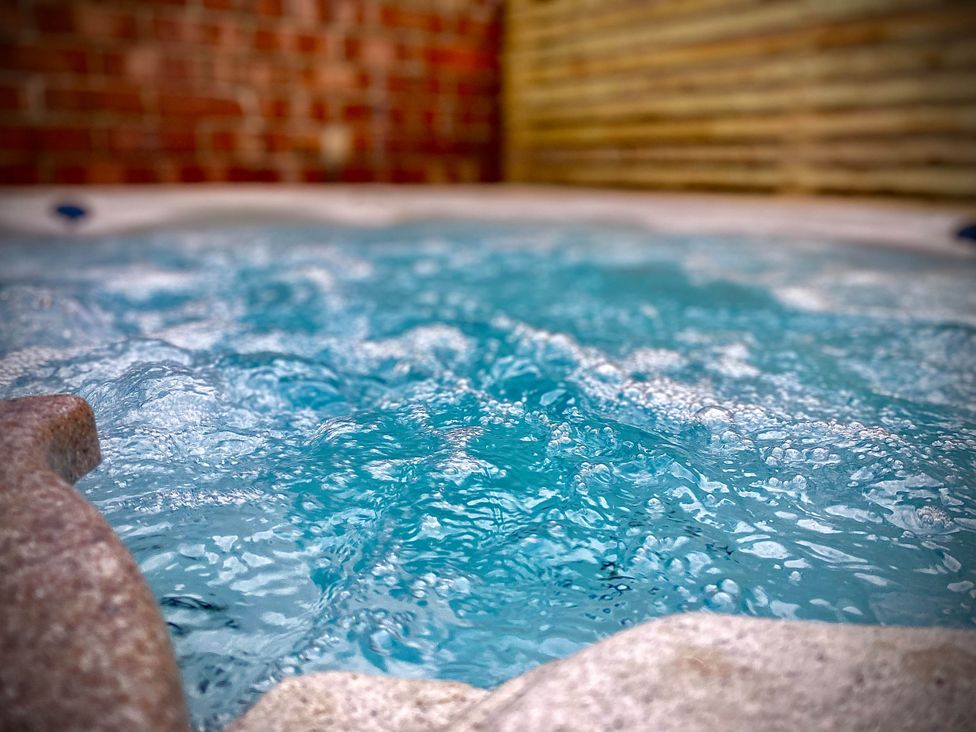 A hot tub filled with water at Family modern 3 bedroom hot tub house Blackpool