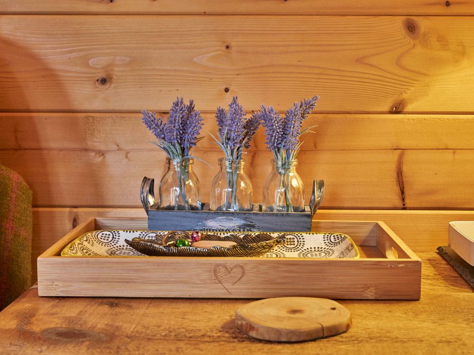 A decorative tray with vases and lavender at Cabin for 2 - Wood Burning Hot Tub & Fire, Larkhall