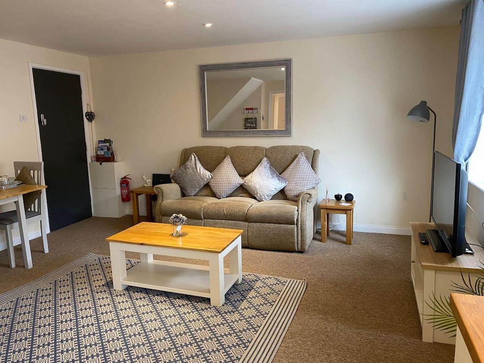 A living room with a sofa and television at Apartment - Sleeps 2 - Pet friendly - Parking, Ludlow