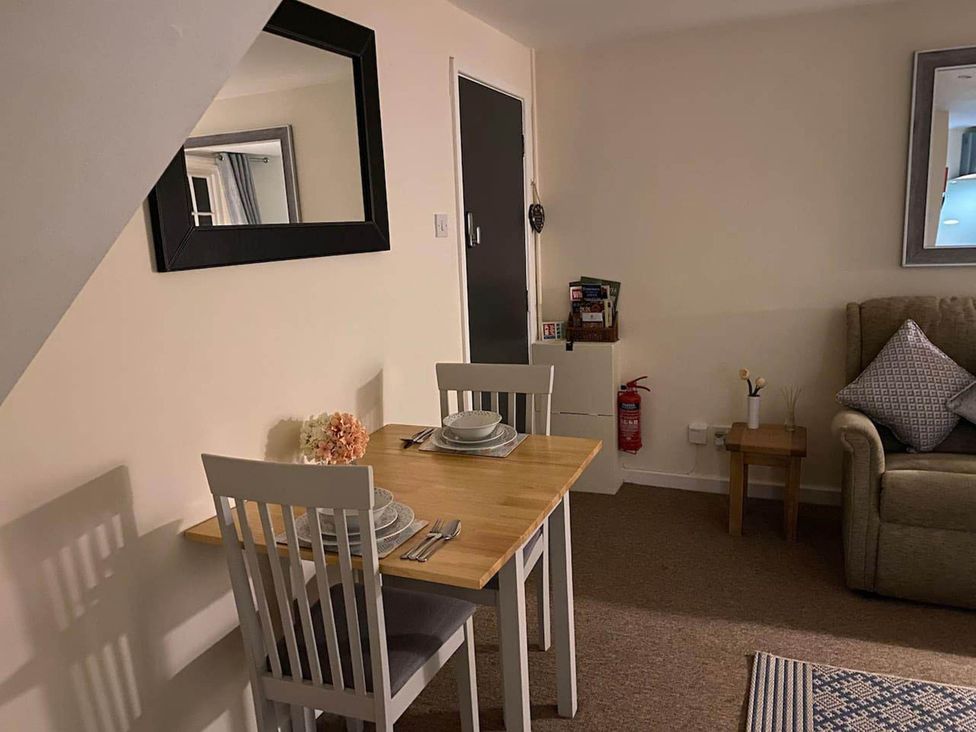 A dining area with table and chairs at Apartment - Sleeps 2 - Pet friendly - Parking, Ludlow
