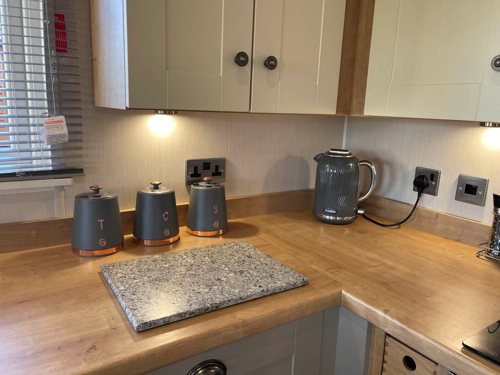 A kitchen with canisters and kettle at Yorkshire View Lodge in Wilberfoss