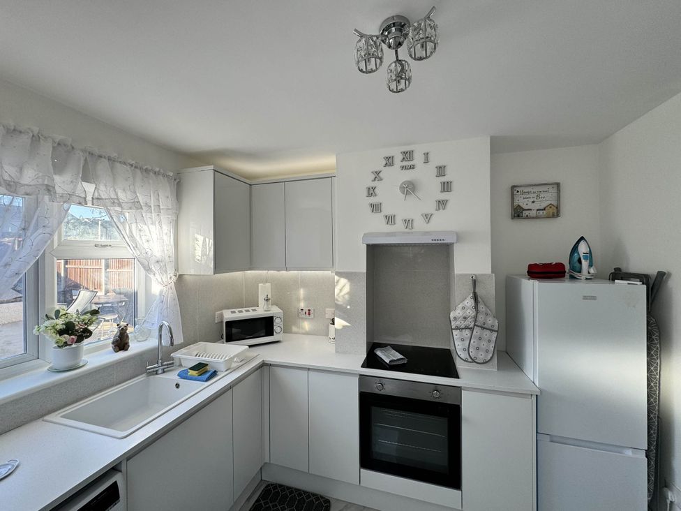 A kitchen with a sink, fridge, oven, and microwave at Modern 3-Bed Hideaway Near Westgate With Parking, Canterbury