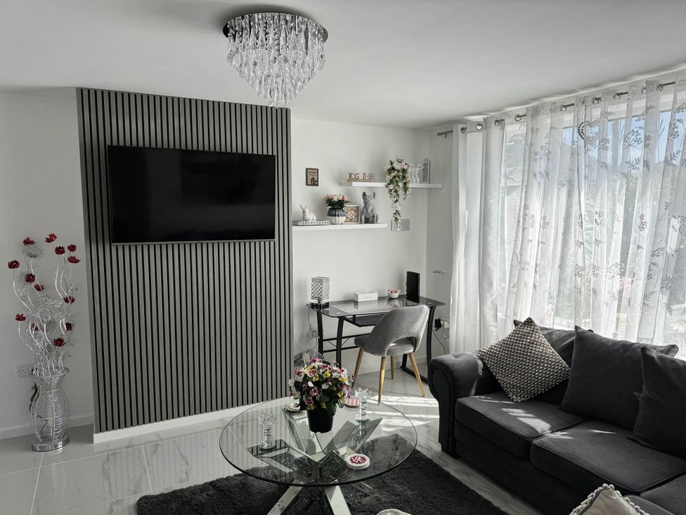 A living room with a television and a coffee table at Modern 3-Bed Hideaway Near Westgate With Parking, Canterbury