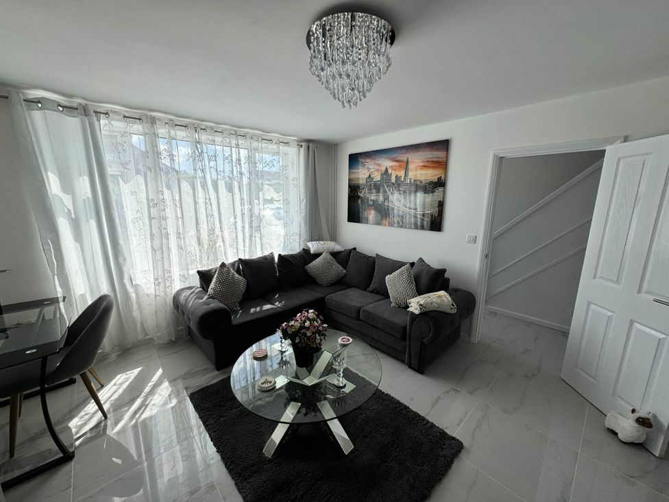 A living room with a sofa and coffee table at Modern 3-Bed Hideaway Near Westgate With Parking in Canterbury