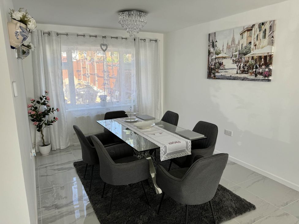 A dining room with a glass table and chairs at Modern 3-Bed Hideaway Near Westgate With Parking Canterbury