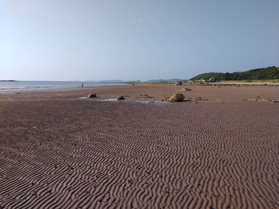 A beach with sand patterns and rocks at Cleeves Cabins 2, Arran Luxury Lodge with hot tub St. John's Town Of Dalry