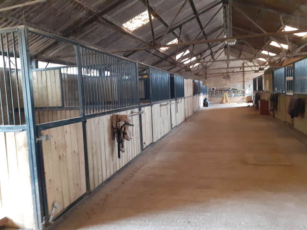 A stable with horse stalls at Glamping at the Retreat Wiltshire is rural bliss Christian Malford