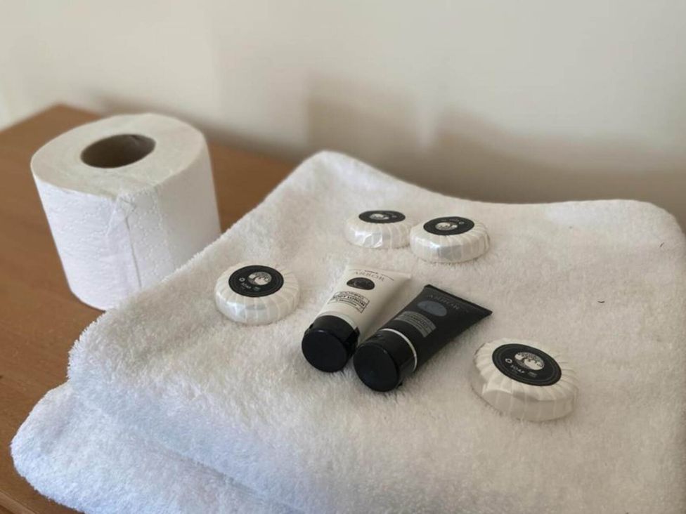A collection of toiletries on towels at House - Sleeps 2 - Patio - Parking in High Wycombe
