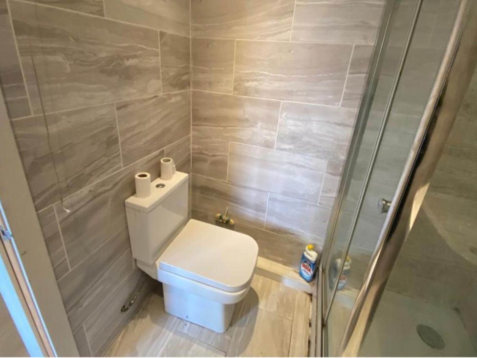 A bathroom with a toilet and shower at House - Sleeps 2 - Patio - Parking in High Wycombe