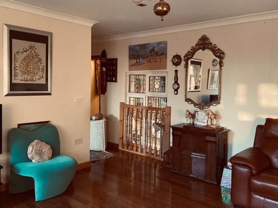 A living room with a chair and cabinet at Apartment - Sleeps 4 - Parking - Balcony - Garden in High Wycombe