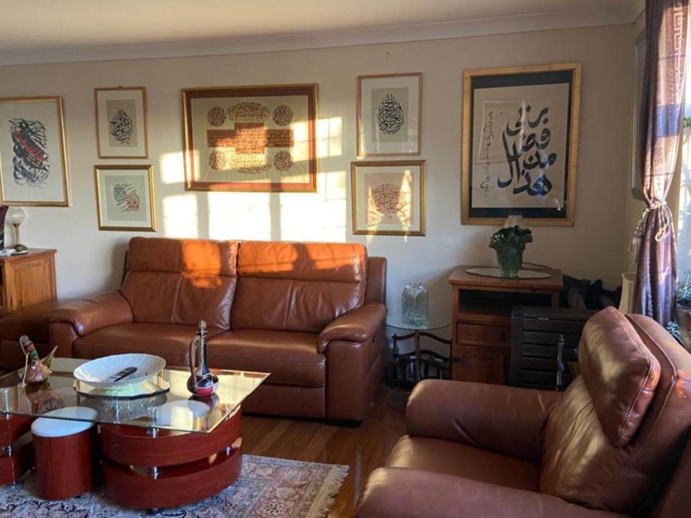 A living room with sofas and artwork at Apartment - Sleeps 4 - Parking - Balcony - Garden, High Wycombe