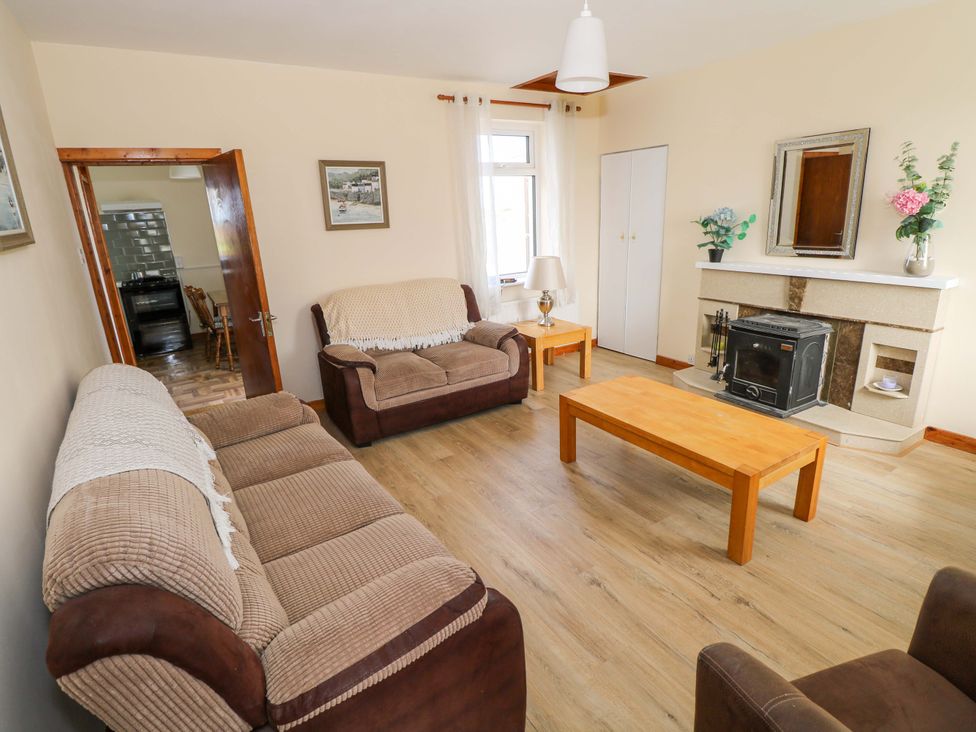 A living room with a fireplace and a coffee table at Ocean View in Westport