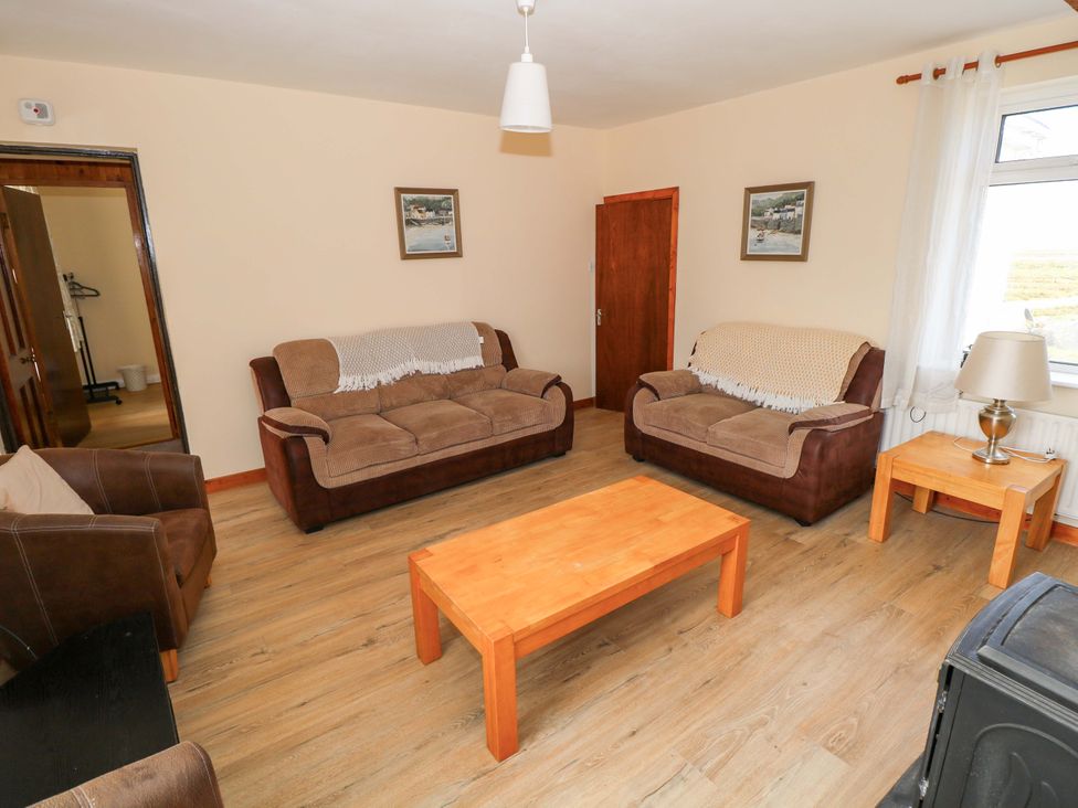 A living room with sofas and a coffee table at Ocean View in Westport