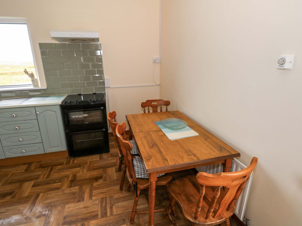 A kitchen with a table and chairs at Ocean View in Westport