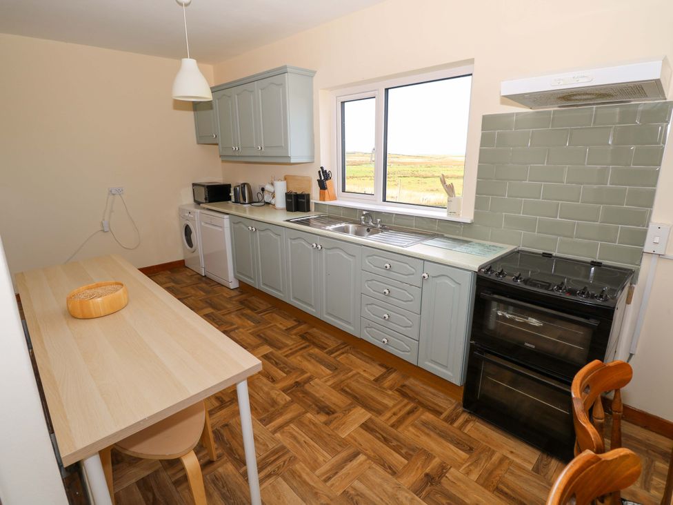 A kitchen with a table and chairs at Ocean View in Westport