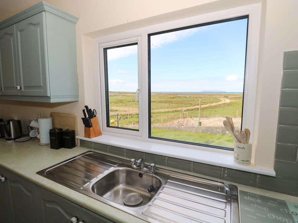 A kitchen with a window overlooking the landscape at Ocean View in Westport
