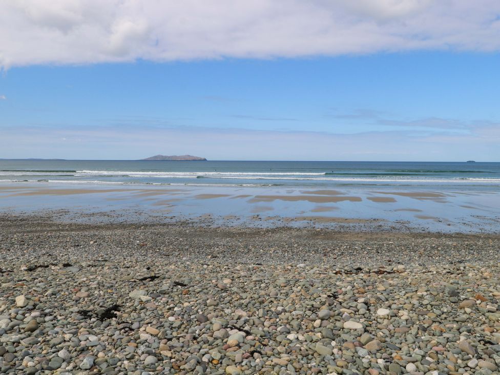 A beach with rocks and water at Ocean View in Westport