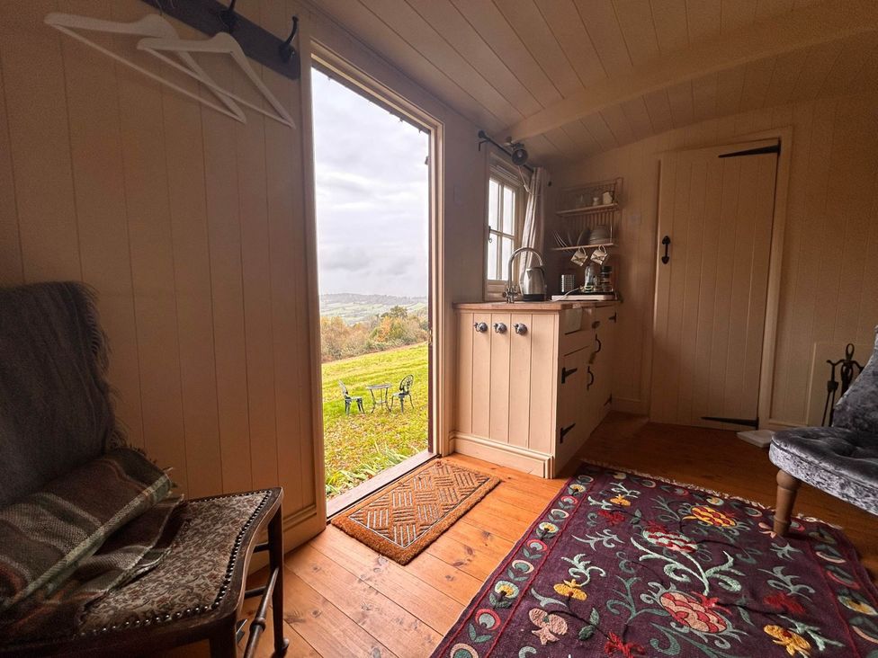 An indoor view with a door leading outside at Cozy Cabin Retreat near Chepstow