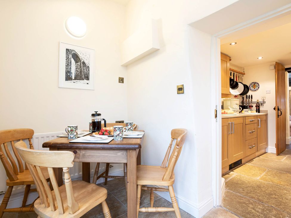 A kitchen with a dining table and chairs at Ingleton 2-Bed Cottage, Sleeps 4, Pet Ok & Parking in Ingleton