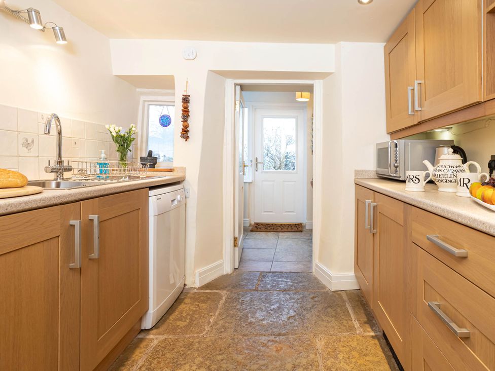 A kitchen with a sink and dishwasher at Ingleton 2-Bed Cottage, Sleeps 4, Pet Ok & Parking, Ingleton