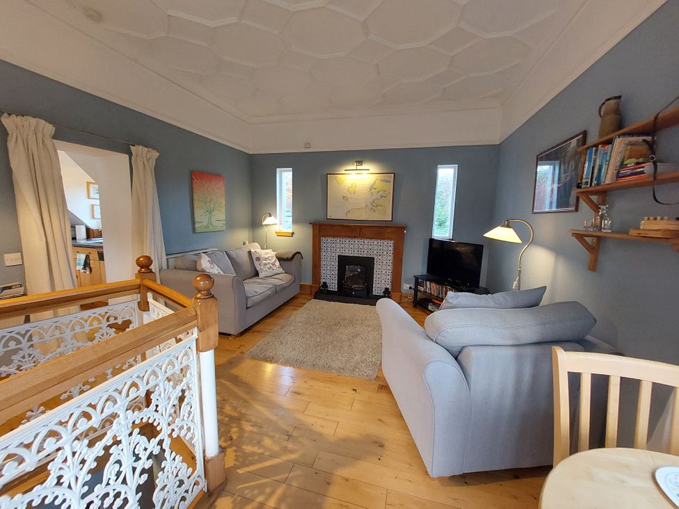 A living room with a sofa and television at 1 Bed Lodge - Sleeps 2 - Parking - Wifi, Salen
