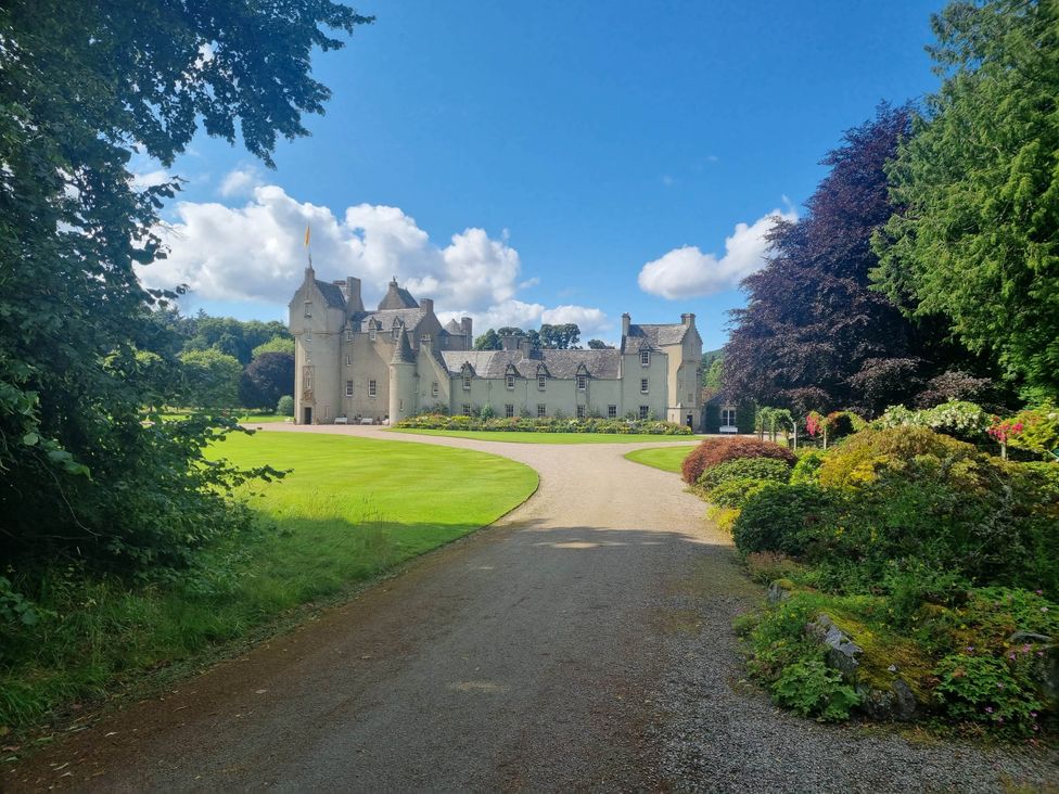 A castle with a landscaped garden at The Coal Office, Aberlour